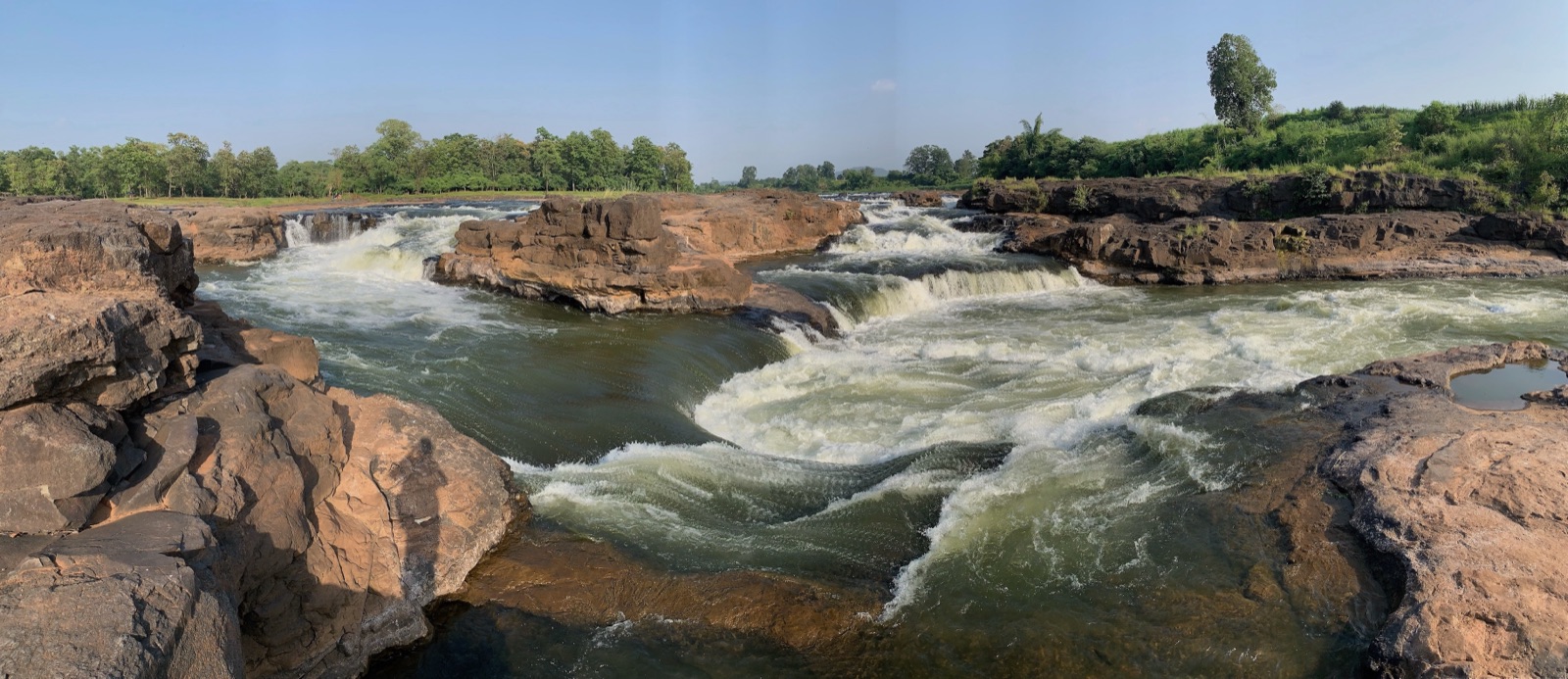 A river running over rocky shelves in the Dangs