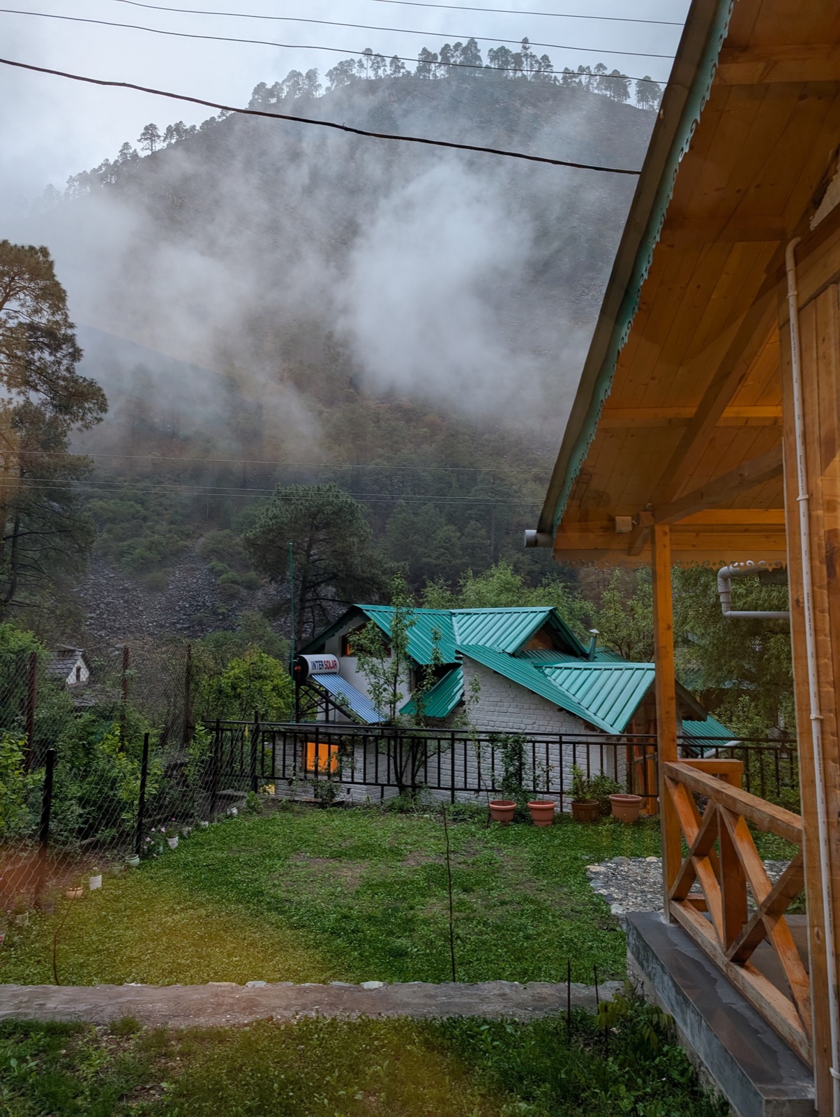 A misty morning from the verandah of the Tirthan stay, the hillside still in cloud